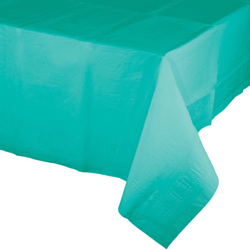 A table cloth that is green and has a blue background.