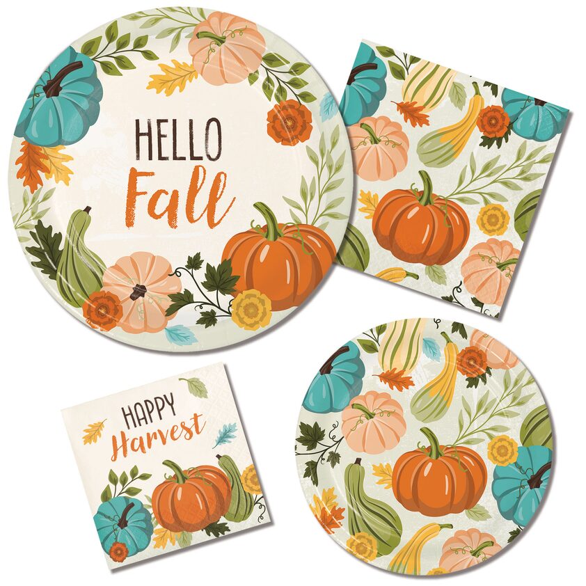 A set of plates and napkins with pumpkins on them.
