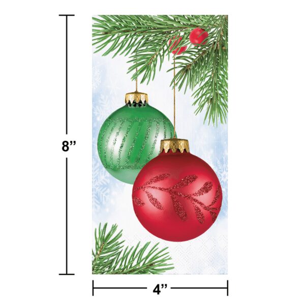 A red and green christmas ornament hanging from a tree.