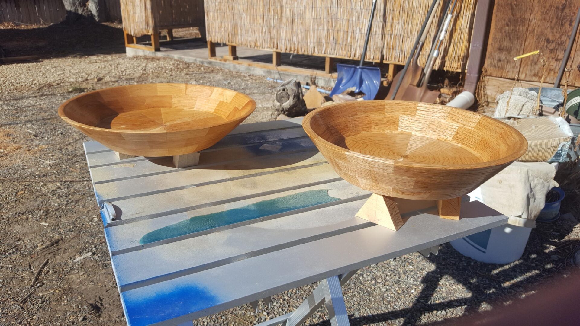 Two wooden bowls sitting on top of a table.