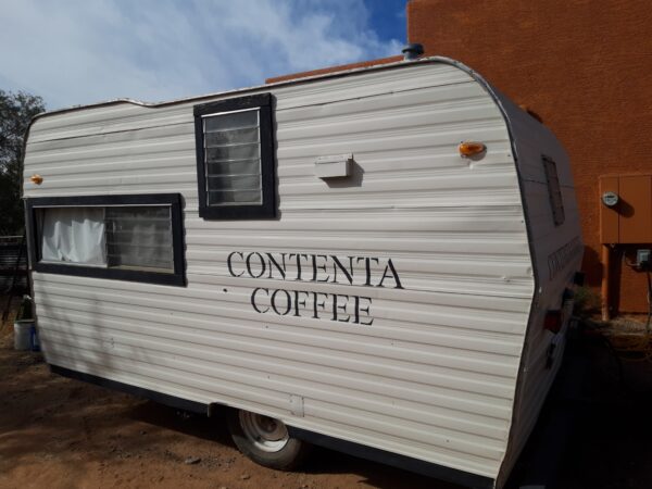 A white trailer with the word " contenta coffee ".